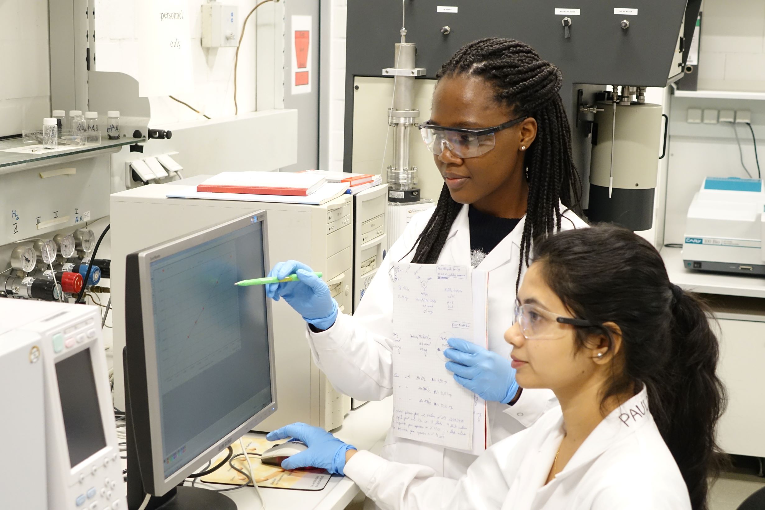 Female students in a chemistry lab