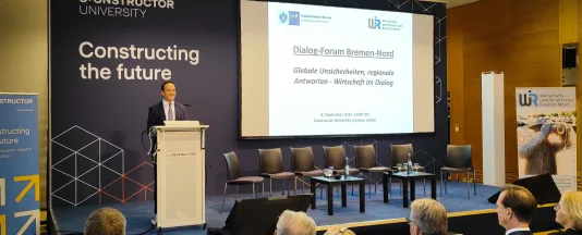 Constructor University Chancellor Turgut Tülü speaking at the event.